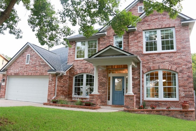 1401 Brixey Cv, Austin, TX 78754 - view of front of property with an attached garage, a front yard, concrete driveway, brick siding, and roof with shingles