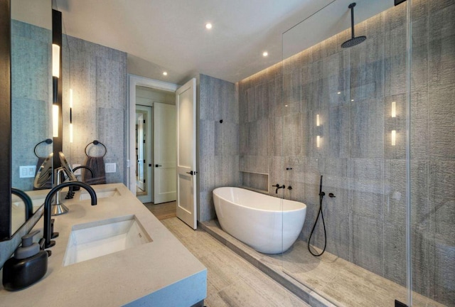 2309 S 4th St, Austin, TX 78704 - full bath with a tile shower, a freestanding bath, recessed lighting, and double vanity