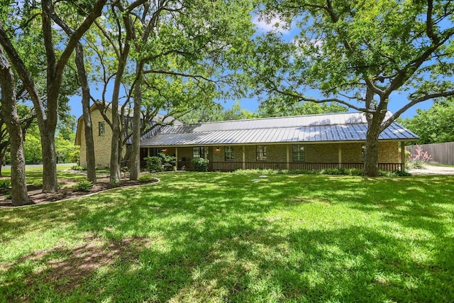 3301 Arrowhead Cir, Round Rock, TX 78681 - rear view of house featuring a metal roof and a standing seam roof
