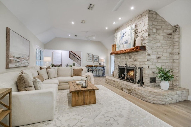 3301 Arrowhead Cir, Round Rock, TX 78681 - living area with wood finished floors, stairway, a fireplace, vaulted ceiling, and recessed lighting