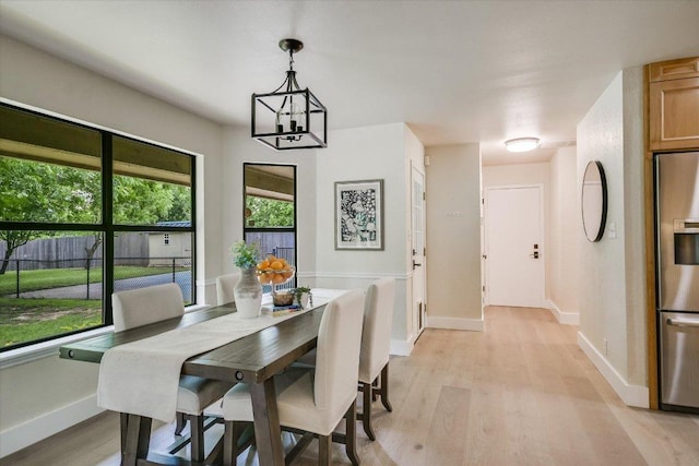 3301 Arrowhead Cir, Round Rock, TX 78681 - dining area with light wood-type flooring and a chandelier