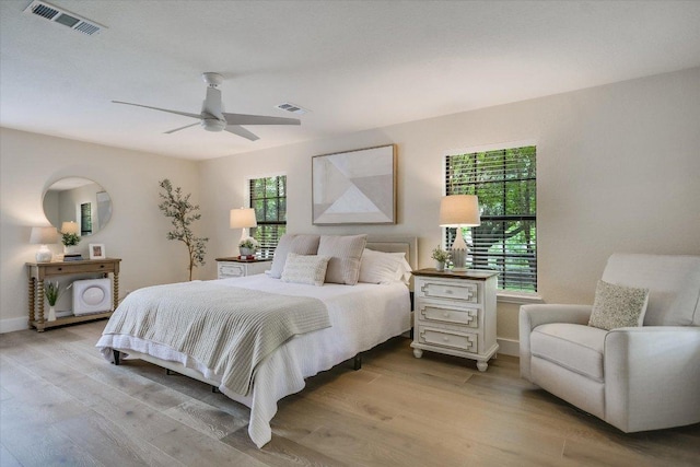 3301 Arrowhead Cir, Round Rock, TX 78681 - bedroom with light wood-style floors and ceiling fan