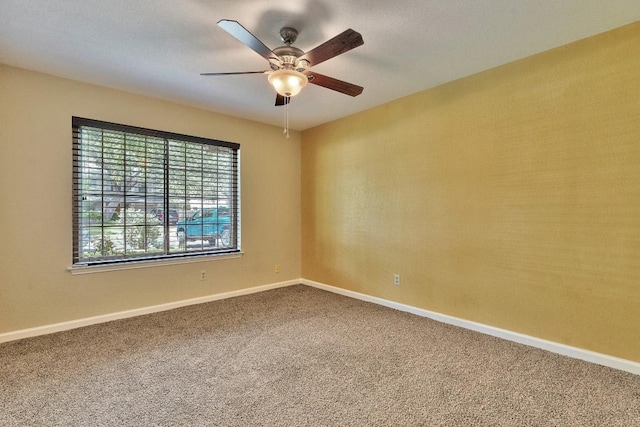 13269 Kerrville Folkway, Austin, TX 78729 - spare room featuring carpet flooring, a ceiling fan, and baseboards