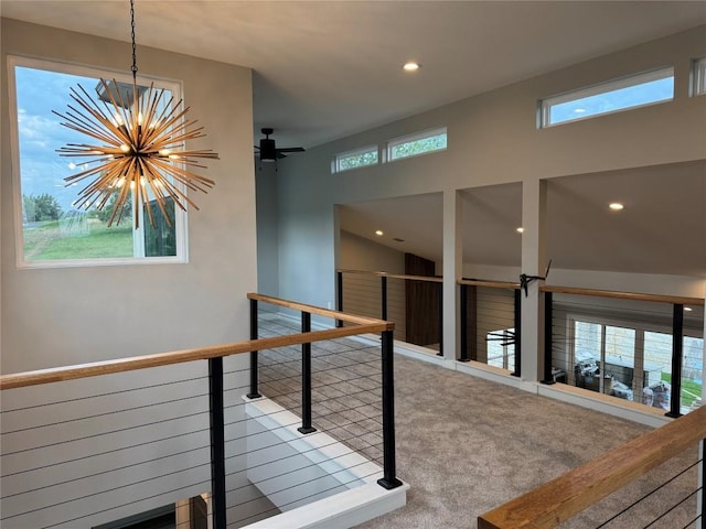 3318 Bay W Blvd, Horseshoe Bay, TX 78657 - corridor with a chandelier, carpet, recessed lighting, and an upstairs landing
