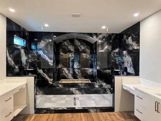 3318 Bay W Blvd, Horseshoe Bay, TX 78657 - bathroom with a marble finish shower, vanity, recessed lighting, and wood finished floors