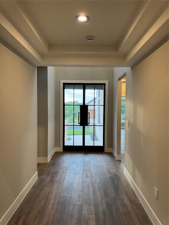 3318 Bay W Blvd, Horseshoe Bay, TX 78657 - entryway featuring a tray ceiling, dark wood-style floors, and recessed lighting