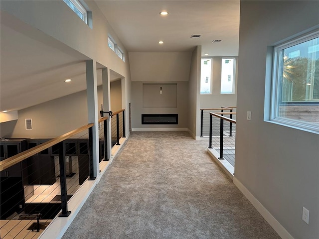 3318 Bay W Blvd, Horseshoe Bay, TX 78657 - corridor featuring an upstairs landing, carpet floors, and recessed lighting