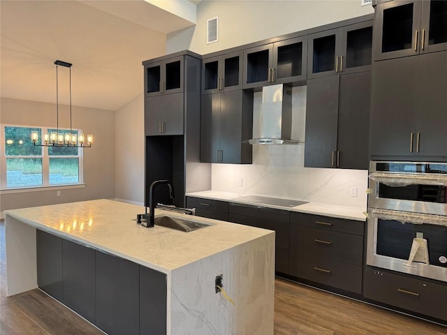 3318 Bay W Blvd, Horseshoe Bay, TX 78657 - kitchen with a sink, wall chimney range hood, black electric stovetop, double oven, and dark wood-style floors