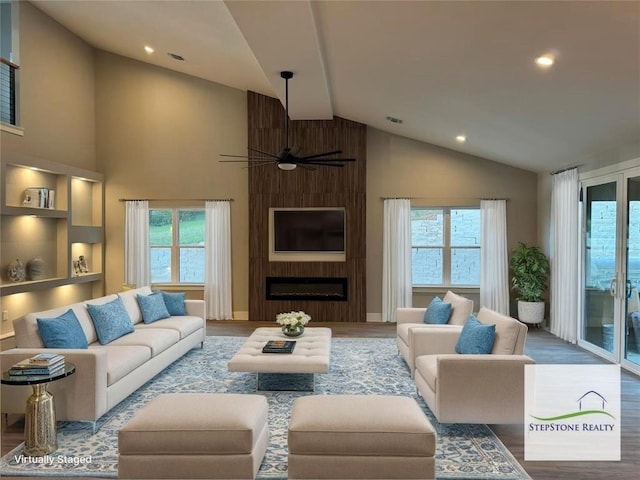 3318 Bay W Blvd, Horseshoe Bay, TX 78657 - living room featuring plenty of natural light, ceiling fan, wood finished floors, recessed lighting, and high vaulted ceiling