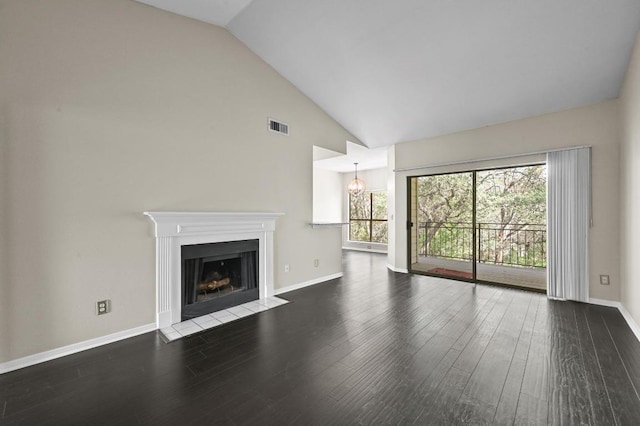 6000 Shepherd Mountain Cv Unit 107, Austin, TX 78730 - unfurnished living room with a fireplace with flush hearth, wood finished floors, baseboards, and high vaulted ceiling
