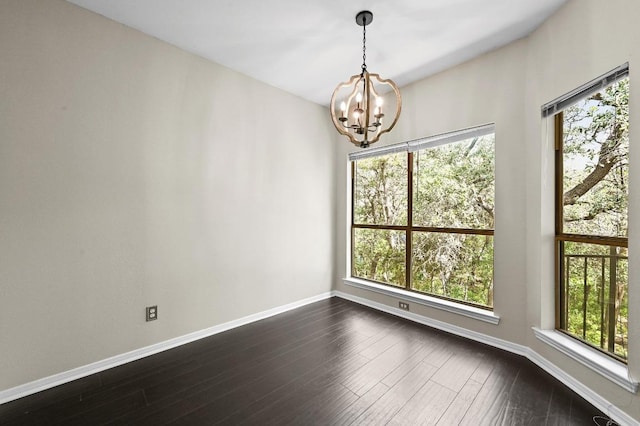6000 Shepherd Mountain Cv Unit 107, Austin, TX 78730 - spare room with a chandelier, baseboards, and dark wood-type flooring