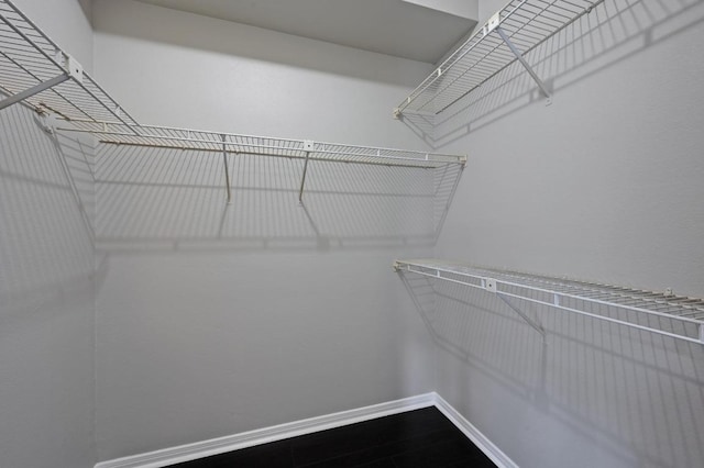 6000 Shepherd Mountain Cv Unit 107, Austin, TX 78730 - walk in closet featuring dark wood finished floors