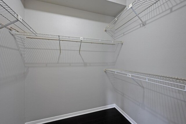 6000 Shepherd Mountain Cv Unit 107, Austin, TX 78730 - spacious closet with dark wood finished floors