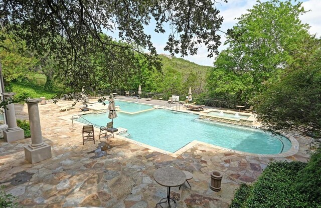6000 Shepherd Mountain Cv Unit 107, Austin, TX 78730 - view of pool featuring a patio area and a pool with connected hot tub