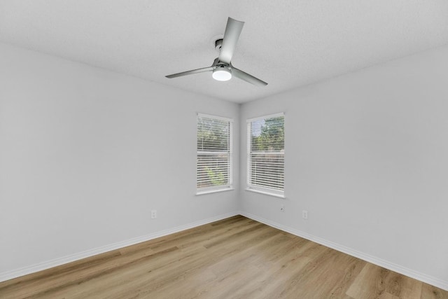 5901 Jacob Gln, Austin, TX 78727 - empty room featuring light wood-style floors, ceiling fan, and baseboards