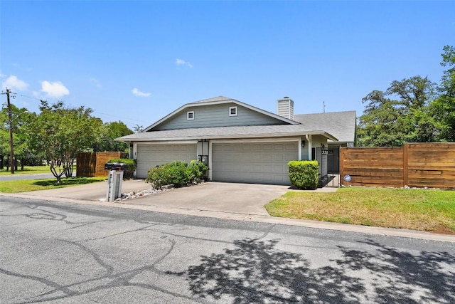view of front facade featuring fence, concrete driveway, a chimney, an attached garage, and roof with shingles