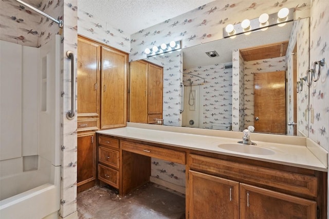 3317 William Cannon Dr Unit A, Austin, TX 78745 - bathroom with wallpapered walls, vanity, a textured ceiling, and shower / bath combination