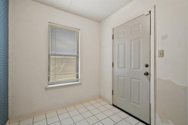 3317 William Cannon Dr Unit A, Austin, TX 78745 - foyer entrance with a textured ceiling and baseboards