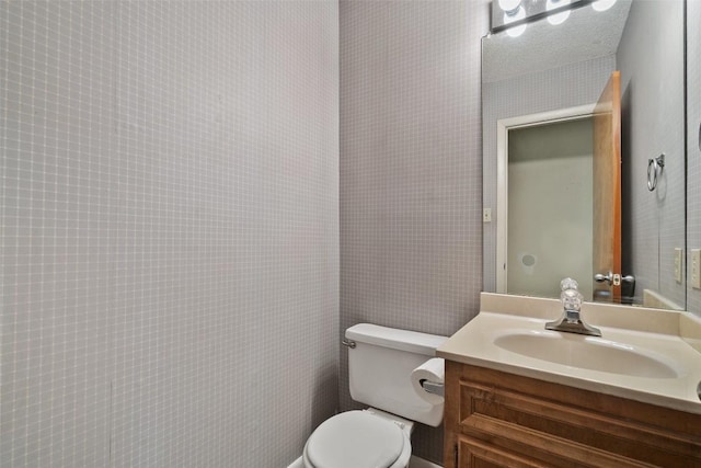 half bath with toilet and vanity