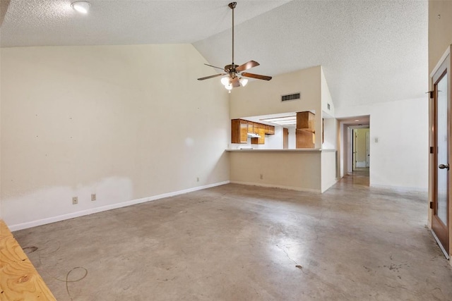 unfurnished living room featuring finished concrete floors, lofted ceiling, a ceiling fan, a textured ceiling, and baseboards