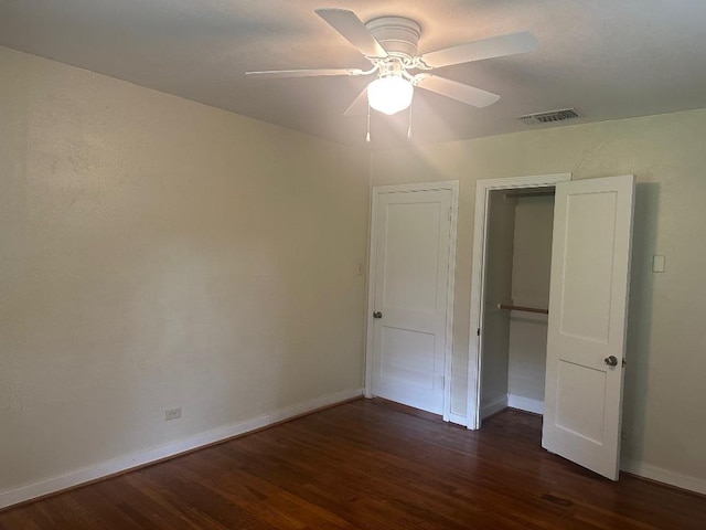 762 E Walnut St, La Grange, TX 78945 - unfurnished bedroom with wood finished floors, baseboards, and a ceiling fan