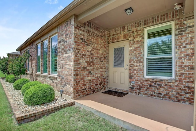 122 Coffee Mill Creek Rd, Georgetown, TX 78633 - view of exterior entry featuring brick siding