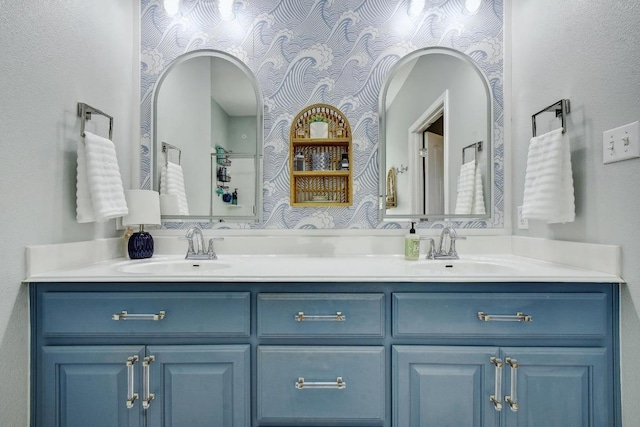 410 Easton Dr, San Marcos, TX 78666 - bathroom featuring double vanity and wallpapered walls