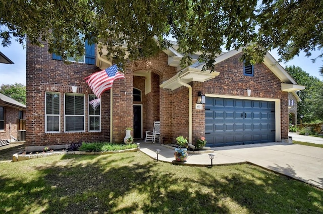 410 Easton Dr, San Marcos, TX 78666 - traditional-style home with brick siding, concrete driveway, and an attached garage