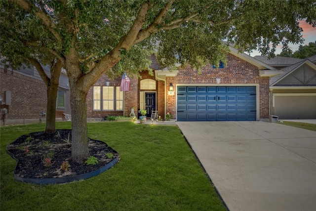 410 Easton Dr, San Marcos, TX 78666 - view of front of home featuring a garage, concrete driveway, a front yard, and brick siding