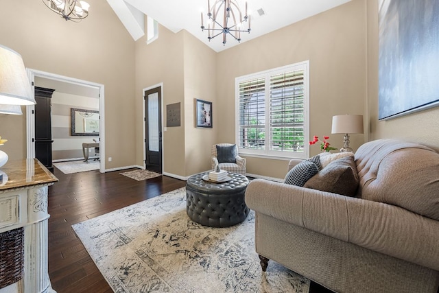 285 Sand Hills Ln, Austin, TX 78737 - living area featuring a chandelier, dark wood-type flooring, baseboards, and high vaulted ceiling