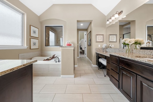 285 Sand Hills Ln, Austin, TX 78737 - full bathroom with vanity, a bath, vaulted ceiling, and tile patterned floors