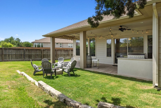 716 Dayridge Dr, Dripping Springs, TX 78620 - view of yard featuring ceiling fan, a wooden deck, and an outdoor fire pit