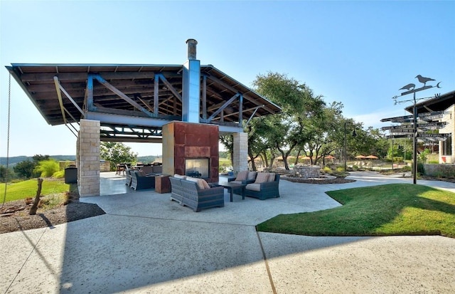716 Dayridge Dr, Dripping Springs, TX 78620 - view of patio featuring an outdoor living space with a fireplace and a gazebo