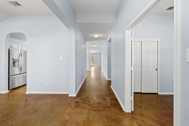 3321 Winding River Trl, Round Rock, TX 78681 - hallway featuring arched walkways, finished concrete floors, and baseboards