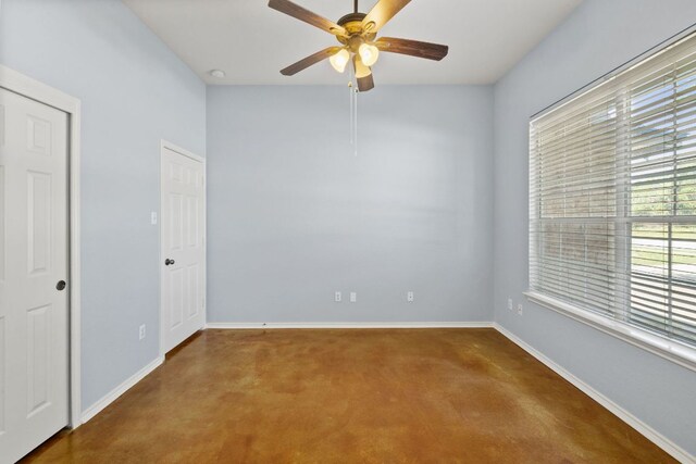 3321 Winding River Trl, Round Rock, TX 78681 - spare room featuring a ceiling fan, baseboards, and finished concrete floors