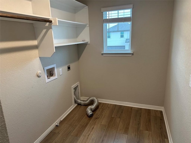 152 Mason Hill Ln, Georgetown, TX 78628 - washroom featuring gas dryer hookup, hookup for an electric dryer, wood finished floors, and baseboards