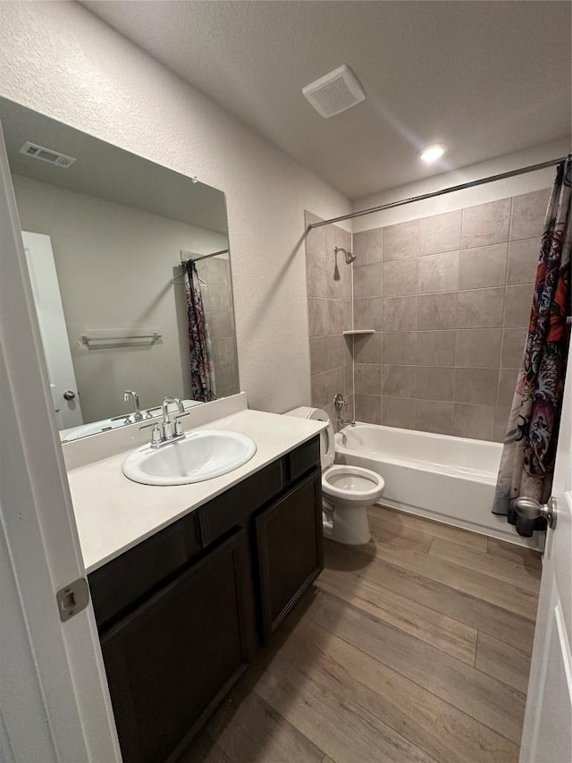 152 Mason Hill Ln, Georgetown, TX 78628 - full bathroom with shower / bath combination with curtain, wood finished floors, vanity, and toilet