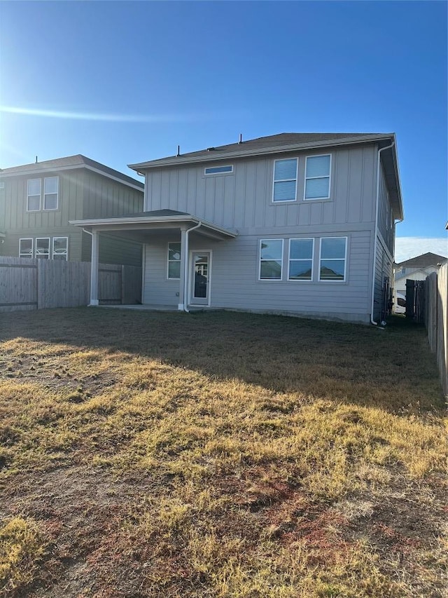 152 Mason Hill Ln, Georgetown, TX 78628 - rear view of property with board and batten siding
