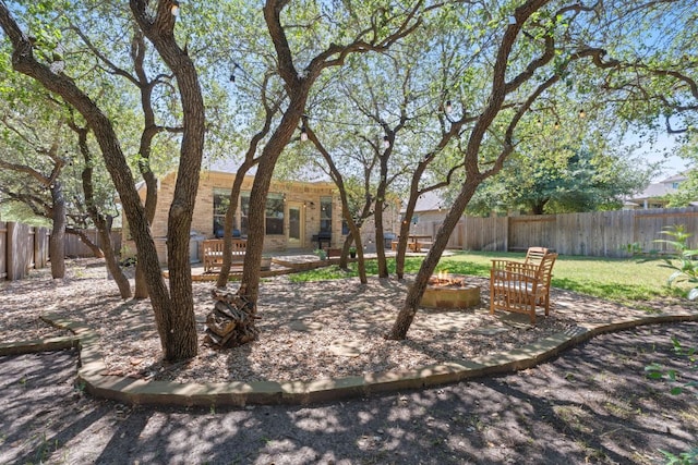 11036 Cherisse Dr, Austin, TX 78739 - fenced backyard featuring an outdoor fire pit and a patio area