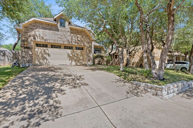 11036 Cherisse Dr, Austin, TX 78739 - view of front facade with concrete driveway and an attached garage