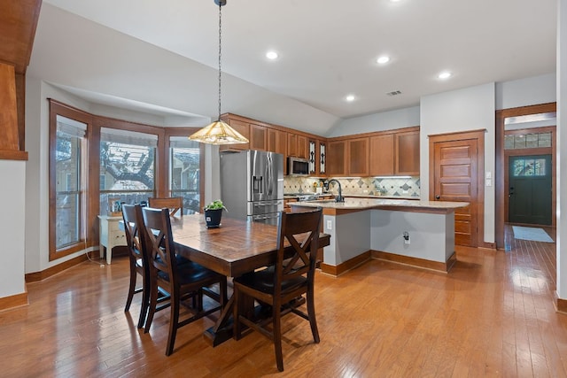 11036 Cherisse Dr, Austin, TX 78739 - dining space with light wood-style floors, vaulted ceiling, baseboards, and recessed lighting