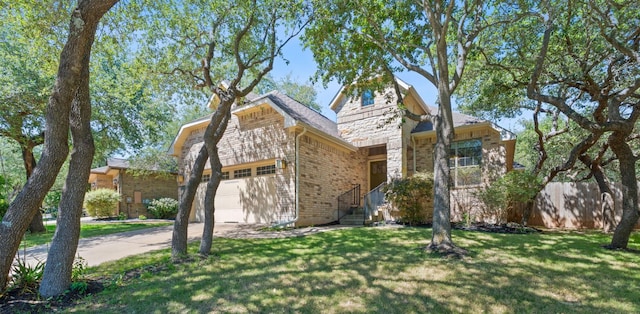 11036 Cherisse Dr, Austin, TX 78739 - view of front of house featuring driveway, a garage, a front lawn, brick siding, and stone siding
