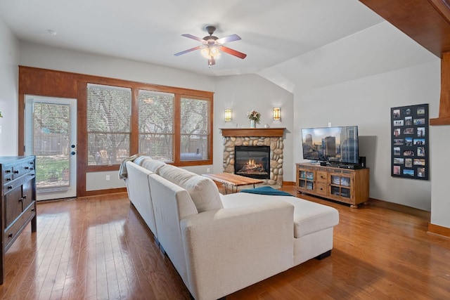 11036 Cherisse Dr, Austin, TX 78739 - living area featuring ceiling fan, a stone fireplace, hardwood / wood-style flooring, and vaulted ceiling