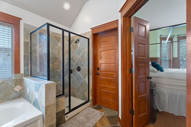 11036 Cherisse Dr, Austin, TX 78739 - bathroom featuring lofted ceiling, a stall shower, a garden tub, and recessed lighting