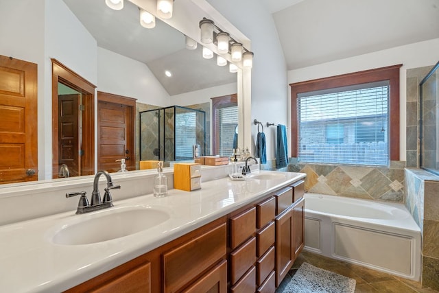 11036 Cherisse Dr, Austin, TX 78739 - bathroom featuring lofted ceiling, a stall shower, a garden tub, double vanity, and tile patterned floors