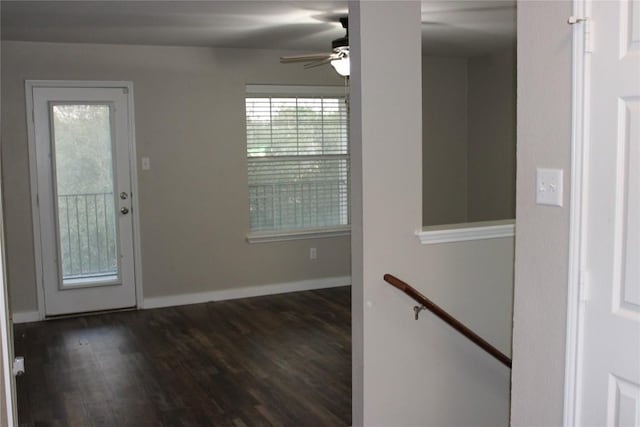 entrance foyer with dark wood finished floors, ceiling fan, and baseboards