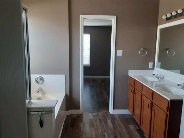 18354 Basket Flower Bnd, Elgin, TX 78621 - full bath with wood finished floors, a bath, and double vanity