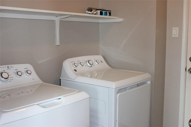 washroom with independent washer and dryer
