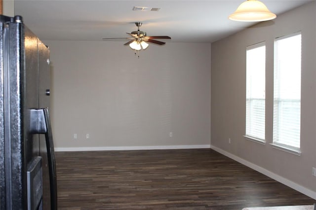 18354 Basket Flower Bnd, Elgin, TX 78621 - empty room with ceiling fan and dark wood-style floors