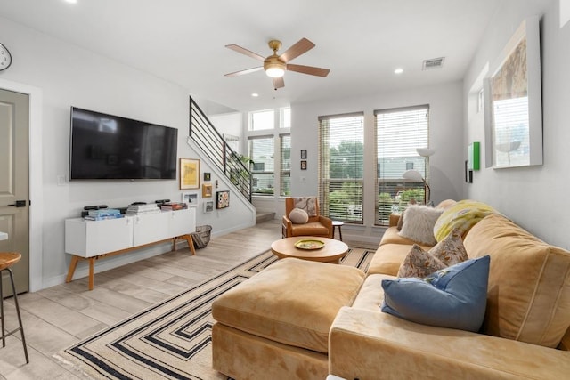 5202 Rob Scott St, Austin, TX 78721 - living area featuring a ceiling fan, stairway, recessed lighting, and light wood-style flooring